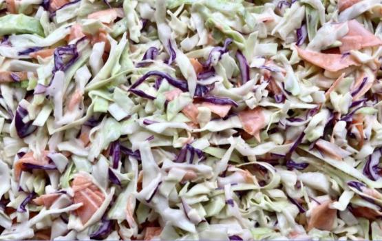 close up of coleslaw recipe featured in this issue, including red cabbage, green cabbage and carrots. 