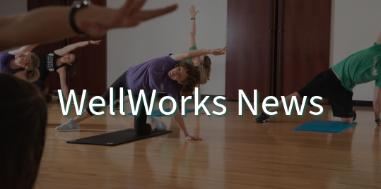People stretching with text overlay saying "WellWorks News."
