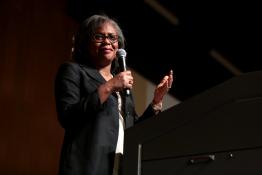 Anita Hill speaking on a stage