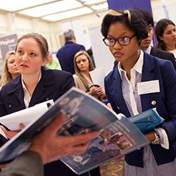 Students engage in conversation at a career fair
