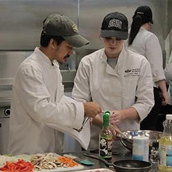 Students work in a kitchen during class