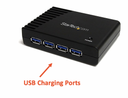 Power supply black box, with an arrow pointing to the USB charging ports