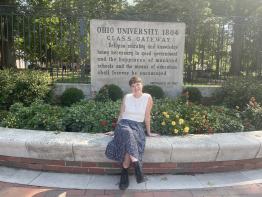 Mady sits infront of OHIO sign