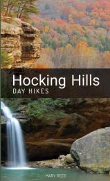 Hocking Hills in the fall with rock ledge and waterfall.