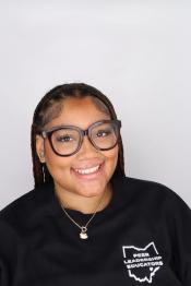 student smiles for a professional portrait