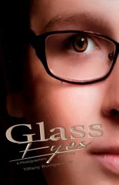 Up close image of side of face with person wearing glasses.