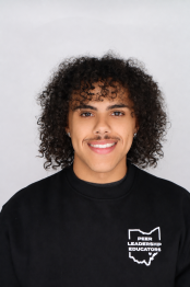 student smiles for a professional portrait