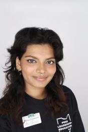 student smiles for a professional portrait
