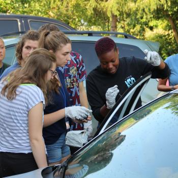Students around a car