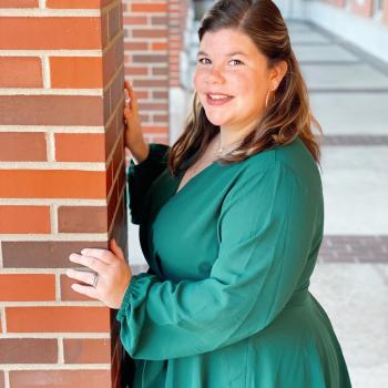 Student Brooke Kelley in a green dress