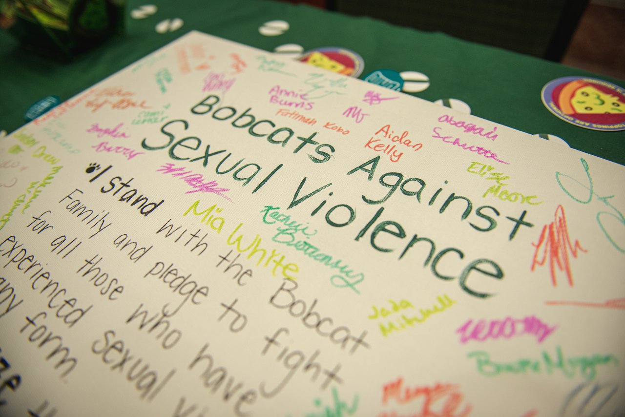 OHIO students were given the opportunity to sign a poster in support of Bobcats against sexual violence. Photo by Eli Burris
