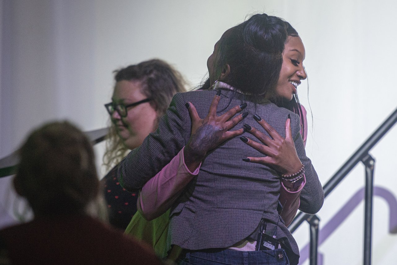 Drea Kelly hugs an OHIO student who helped introduce her. Photo by Eli Burris