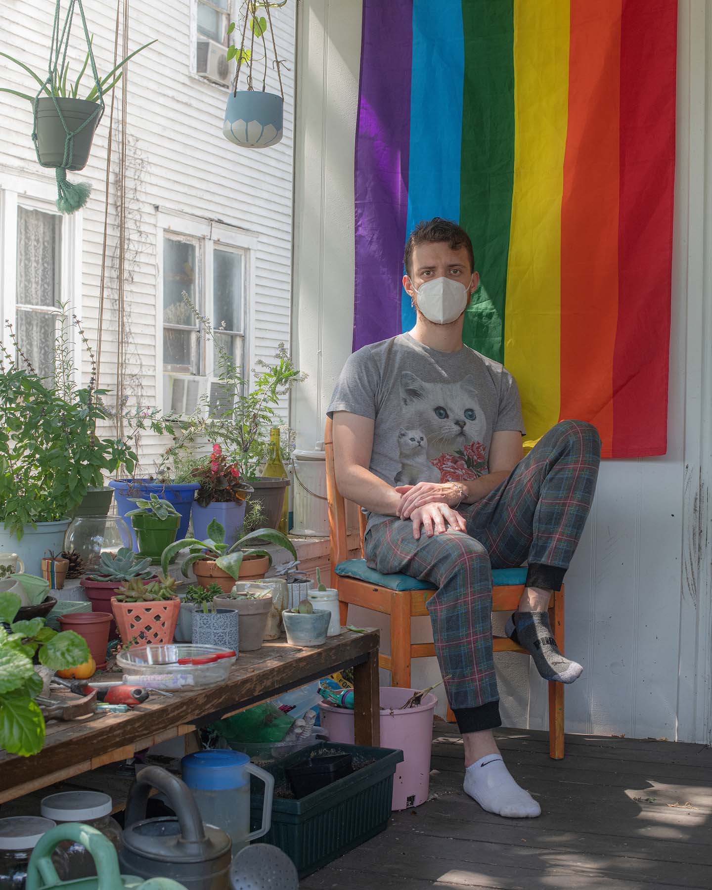 Marco Omta posing with his residence's pride flag for a portrait
