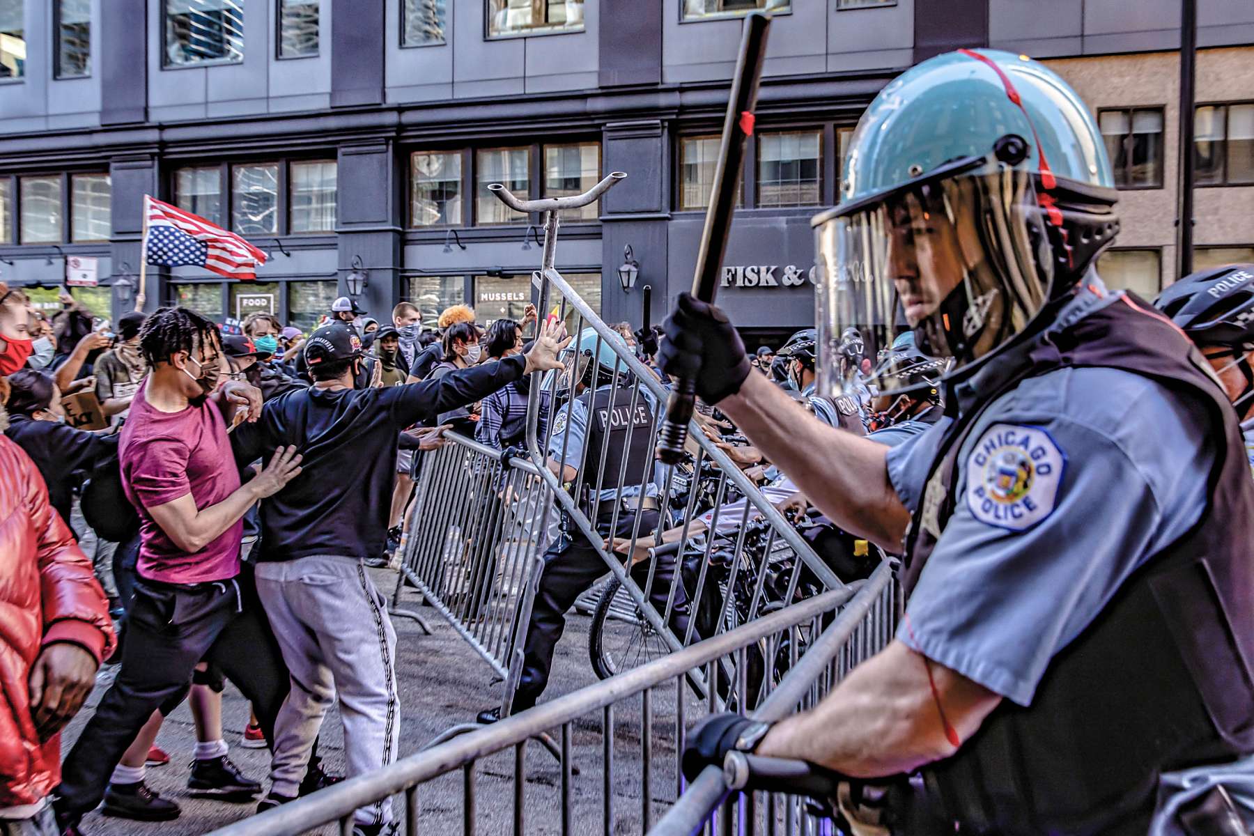 Police try to keep order as violent protestors encroach them in the streets of Chicago