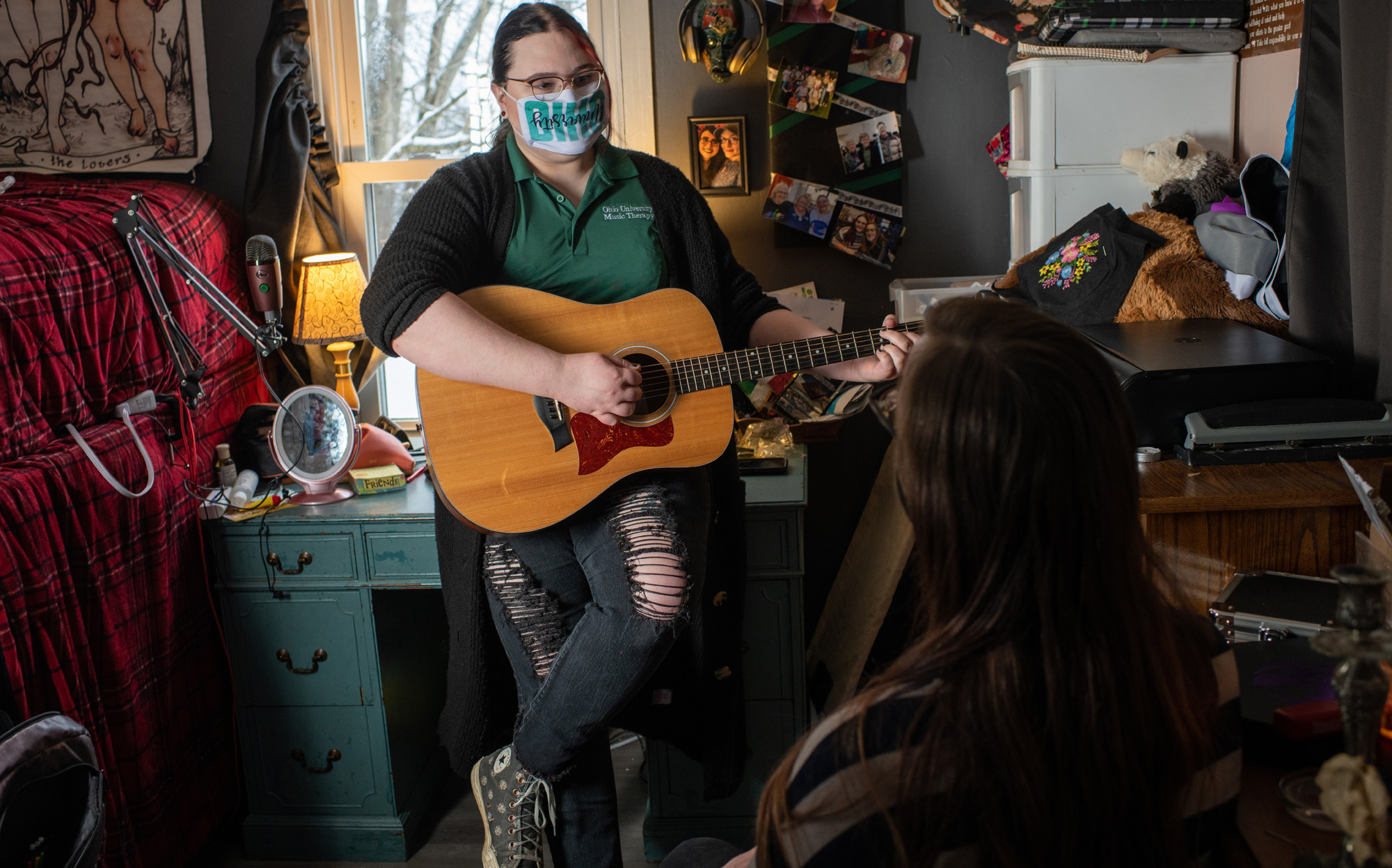 A student engages in music therapy in a bedroom