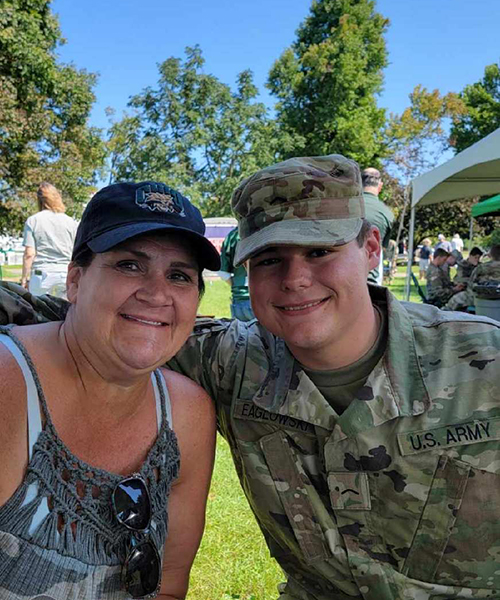 Trae Eaglowski enjoys some time with his mother, Lori, and his fellow Bobcat Battalion cadets and cadre during this fall’s Ohio University Parents Weekend.