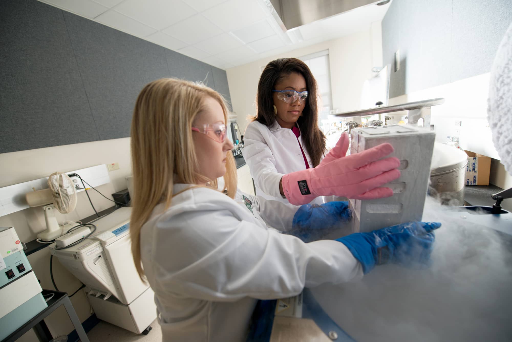 Heritage College Professor Kelly McCall, Ph.D., and student LaDonya Jackson work in the Academic and Research Center. McCall, along with Russ College professor Douglas Goetz, Ph.D., received a grant to investigate possible treatments to mitigate the severity of COVID-19.
