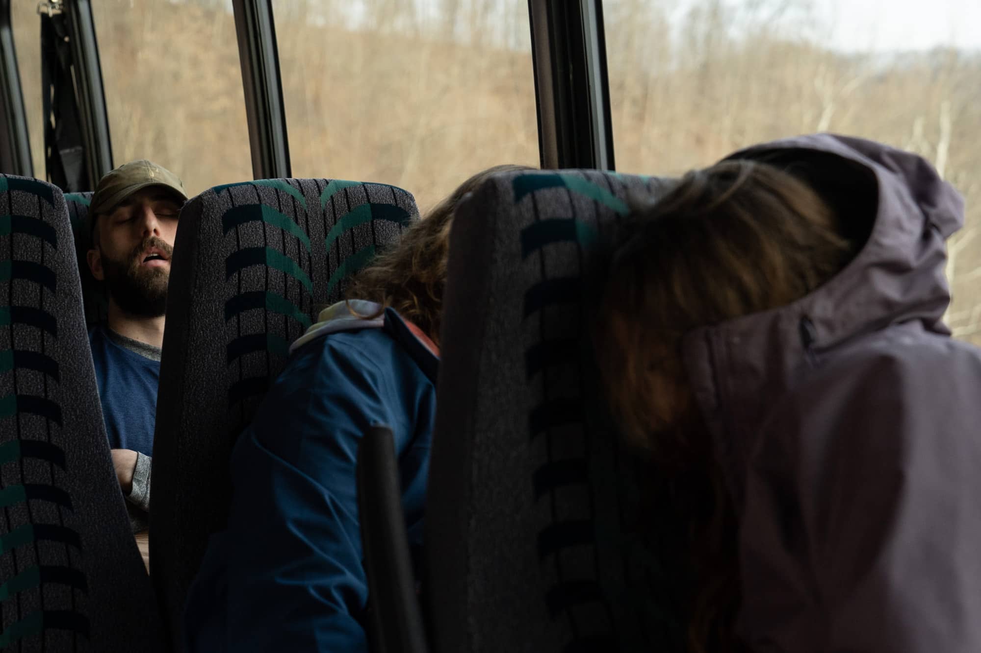Eamonn Bell, Helena Karlstrom and Melanie Ahmetspahic sleep on the bus on the way to backpack a section of the Appalachian Trail in the Nantahala National Forest on Saturday, March 5, 2022, in North Carolina.