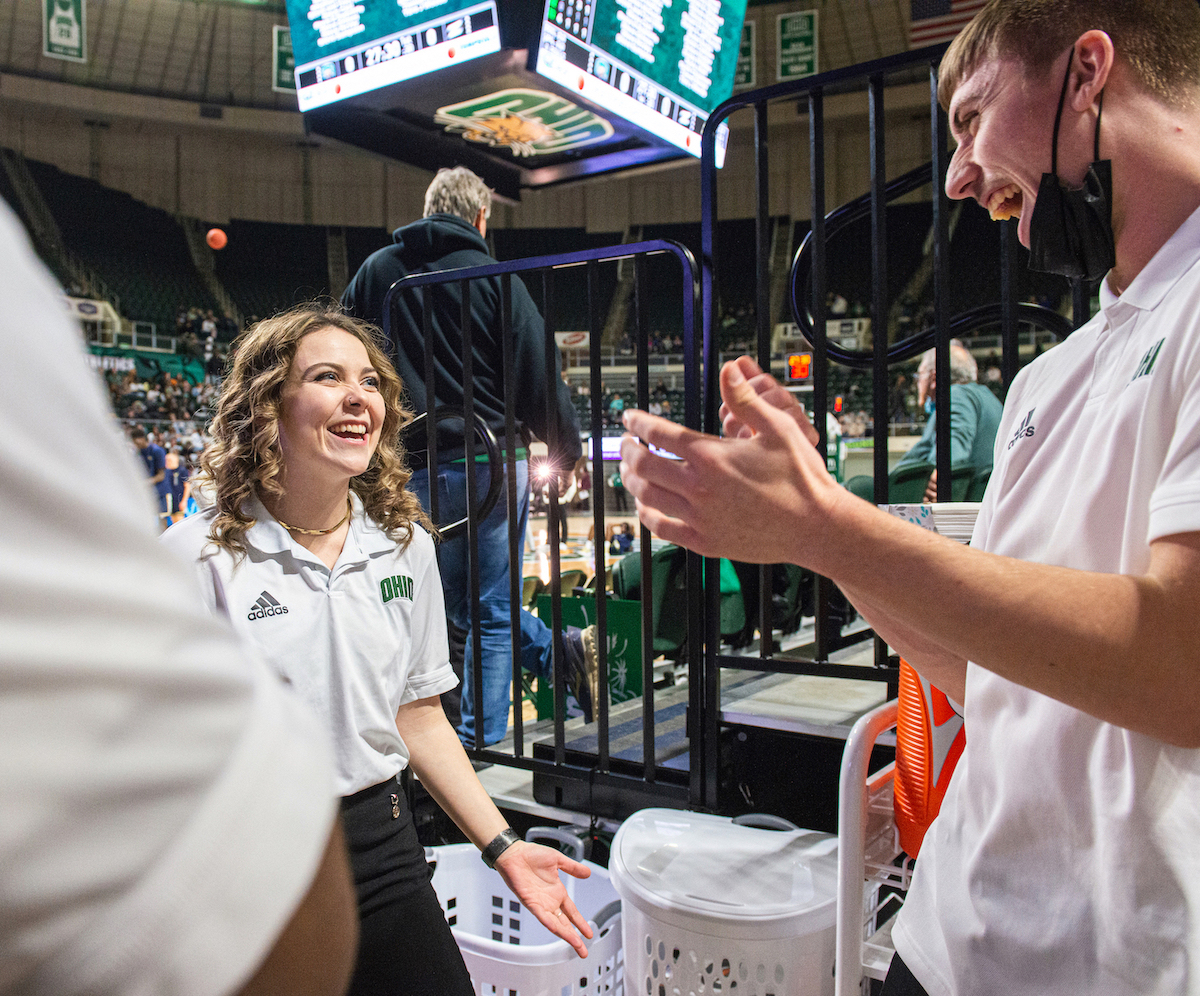 Jess North talks to another student manager in the Convo Center