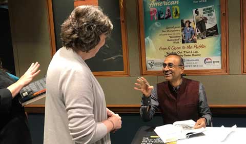 Dr. Venki Ramakrishnan enjoys signing books.
