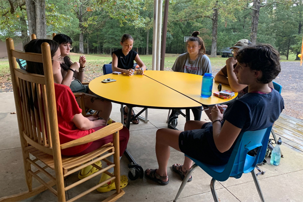 The OHIO team is shown playing a card game.