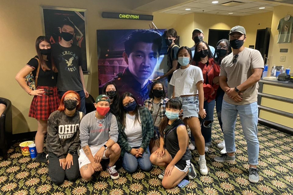 AAPISU are shown together at a local movie theater.