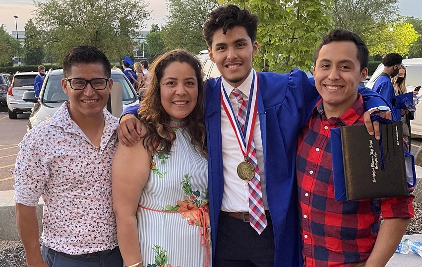 Johan Mendez is shown with family members after his high school graduation ceremony