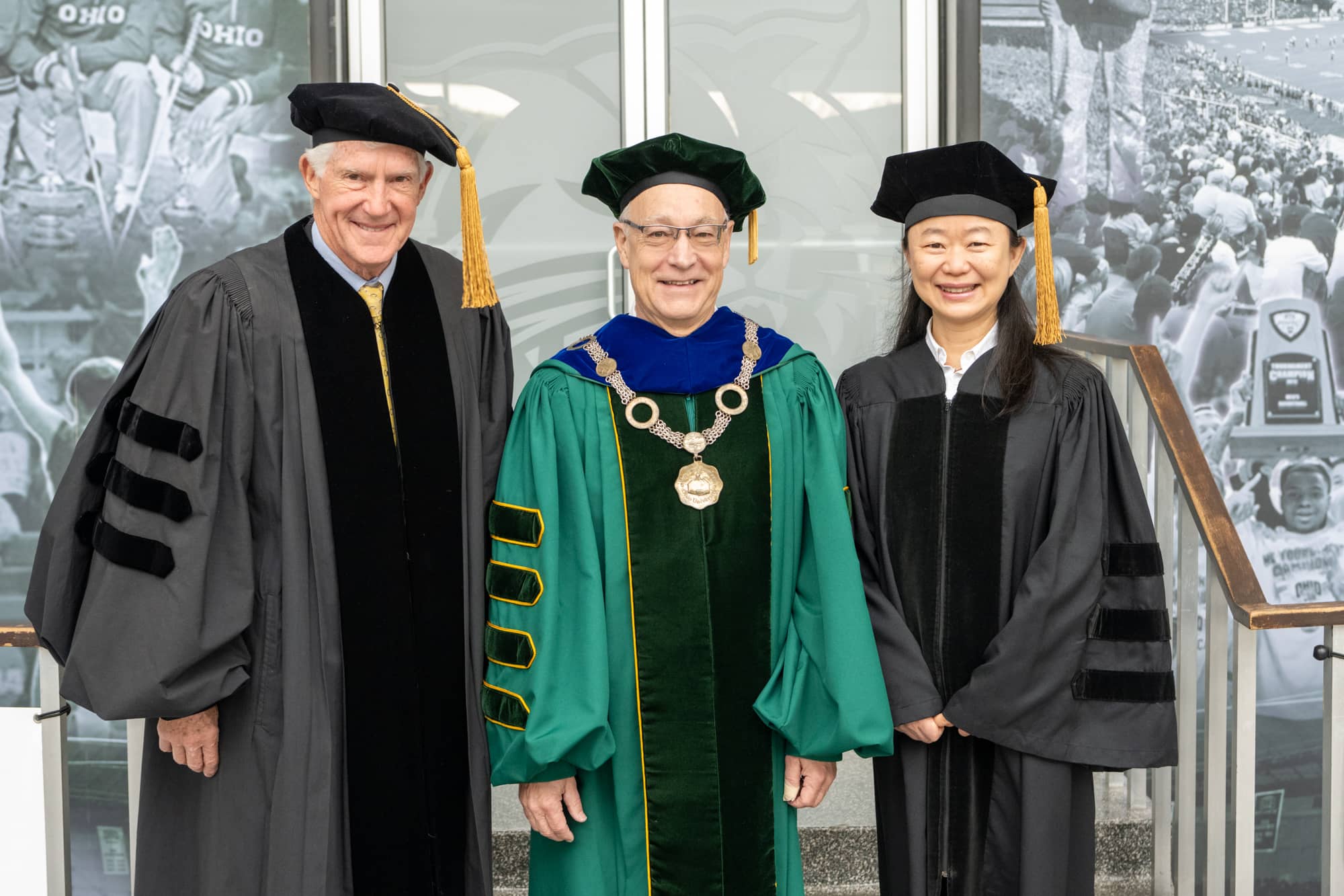 Ohio University President Hugh Sherman (Center) poses for a photo with honorary degree recipients John Roush (Left) and Jue Chen prior to graduate commencement ceremonies.