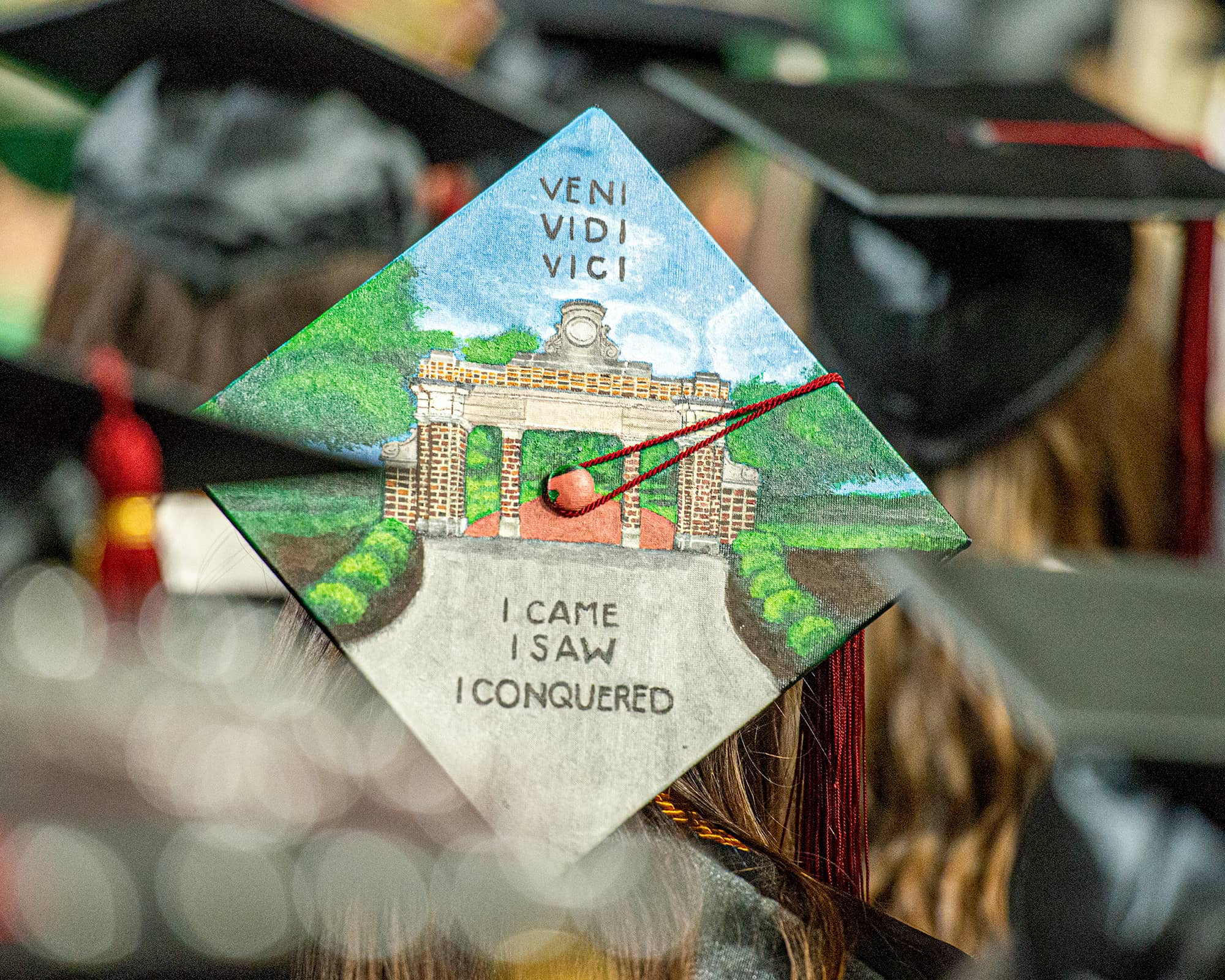 A student at Undergraduate Commencement decorated their cap with a picture of College Gate with the inscription, “Veni, Vidi, Vinci”, Latin for, “I came, I saw, I conquered.” 
