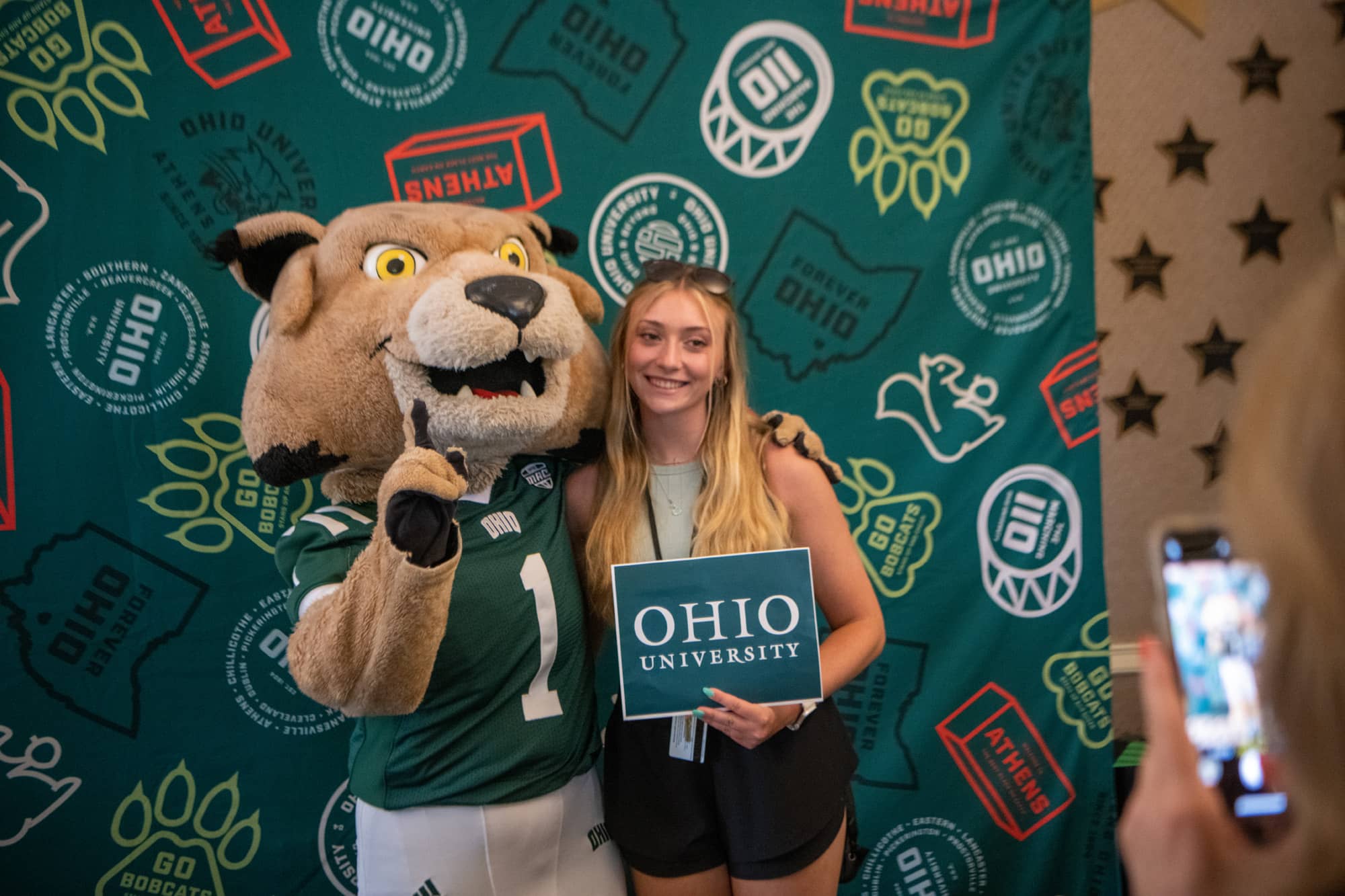 A student poses for a photo with Rufus at BSO.