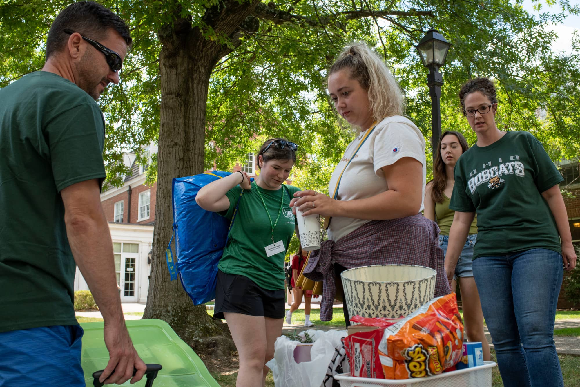 Ohio University students help incoming students move into their dorms on East Green.