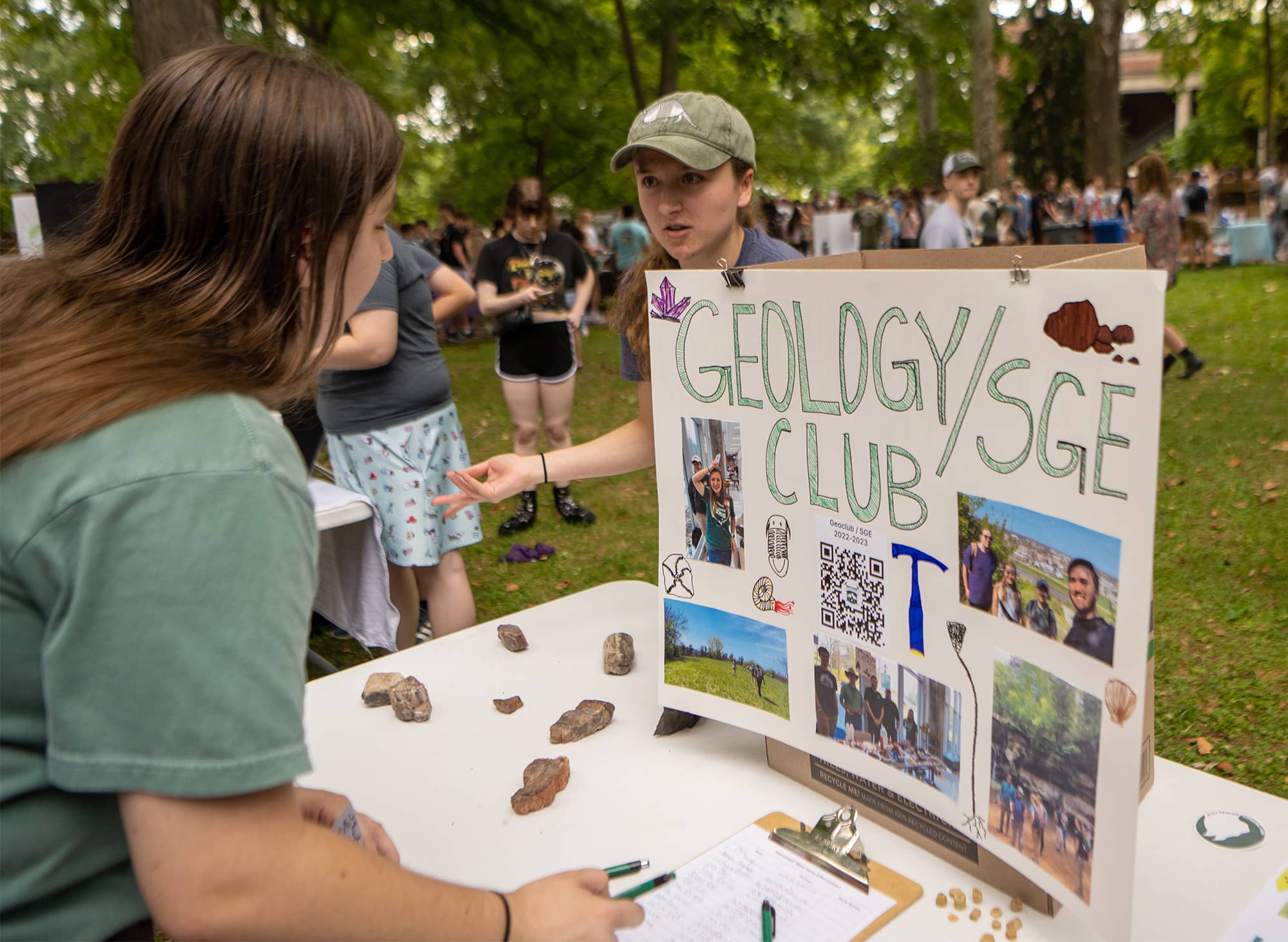 A member of the Geology Club recruits students at Student Organization Involvement Fair on College Green.