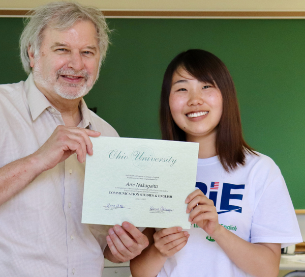 OPIE Director Gerry Krzic and Chubu student Ami Nakagaito display her program certificate.