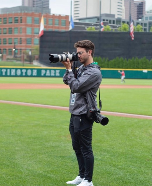 Clay Stark is shown taking photographs at a Columbus Clippers game
