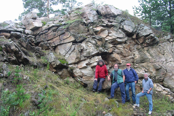 Damian Nance (right) with colleagues (left to right) Brendan Murphy (Canada), Rob Strachan (U.K.) and Cecilio Quesada (Spain) in 2005 examining an outcrop in the Ural Mountains of Russia that shows almost identical relationships to those in the northern Appalachians, the U.K., and western Europe.