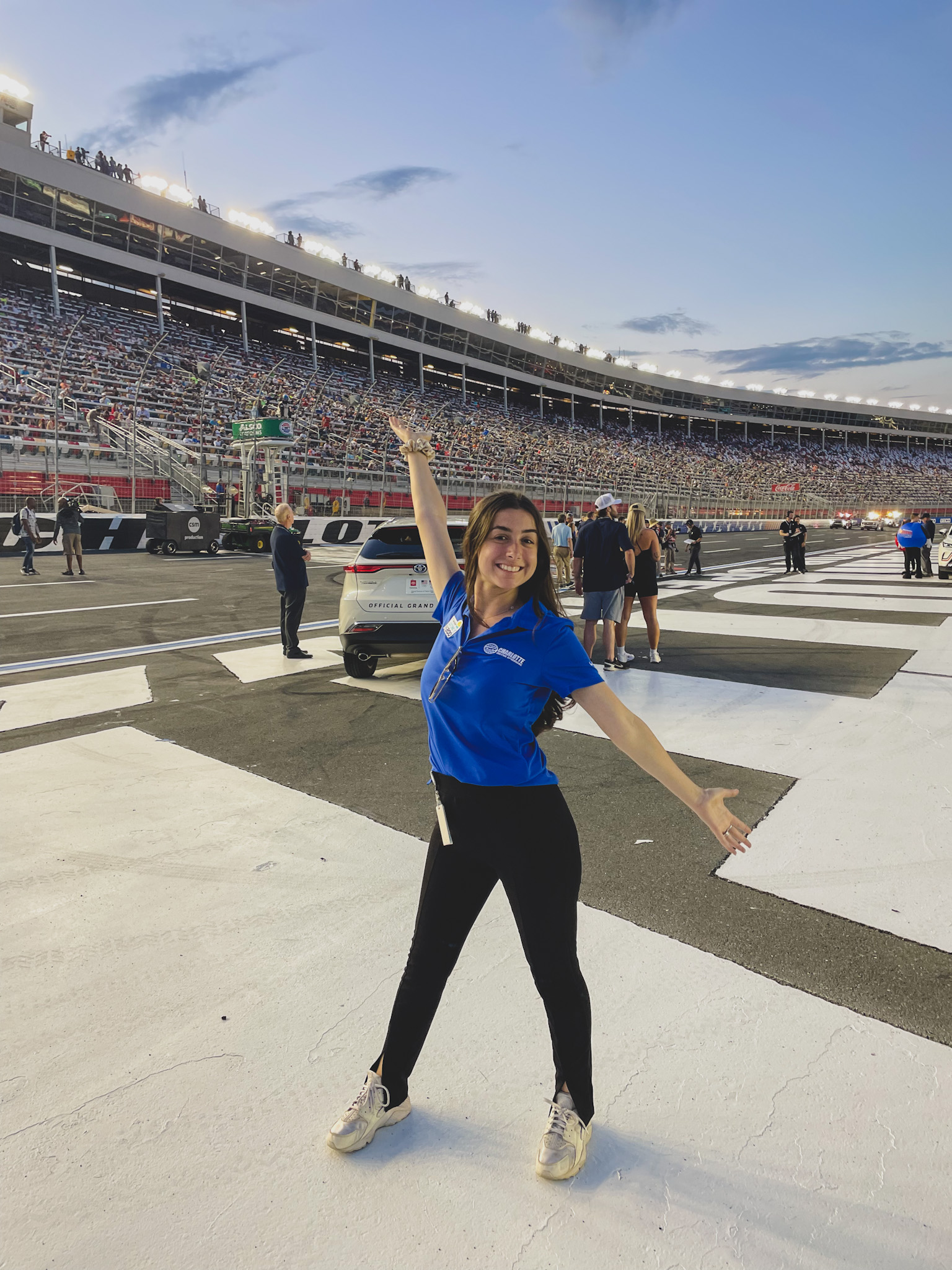 Ohio University student Sam Spinale poses in front of Charlotte Motor Speedway during internship. 
