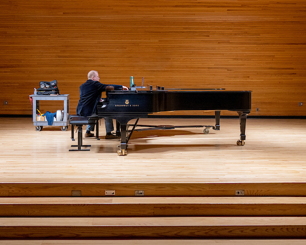 Purdy finds pleasure in music whereas preserving pianos in tune