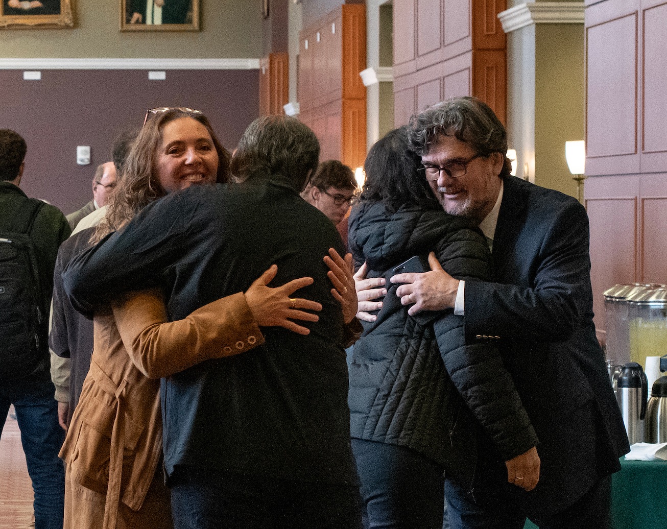 Srdjan Nesic, professor in the Russ College of Engineering and Technology and director of the Institute for Corrosion and Multiphase Flow Technology, and his wife hug attendees at Nesic’s Distinguished Professor Lecture and Portrait Unveiling at the Baker Ballroom in Athens, Ohio.