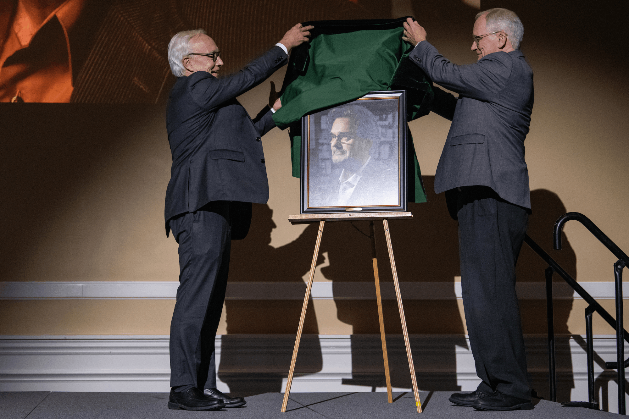 Dr. Hugh Sherman, President of Ohio University, helps to unveil Professor Srdjan Nesic’s official portrait at Nesic’s Distinguished Professor Lecture and Portrait Unveiling in the Baker Ballroom in Athens, Ohio.