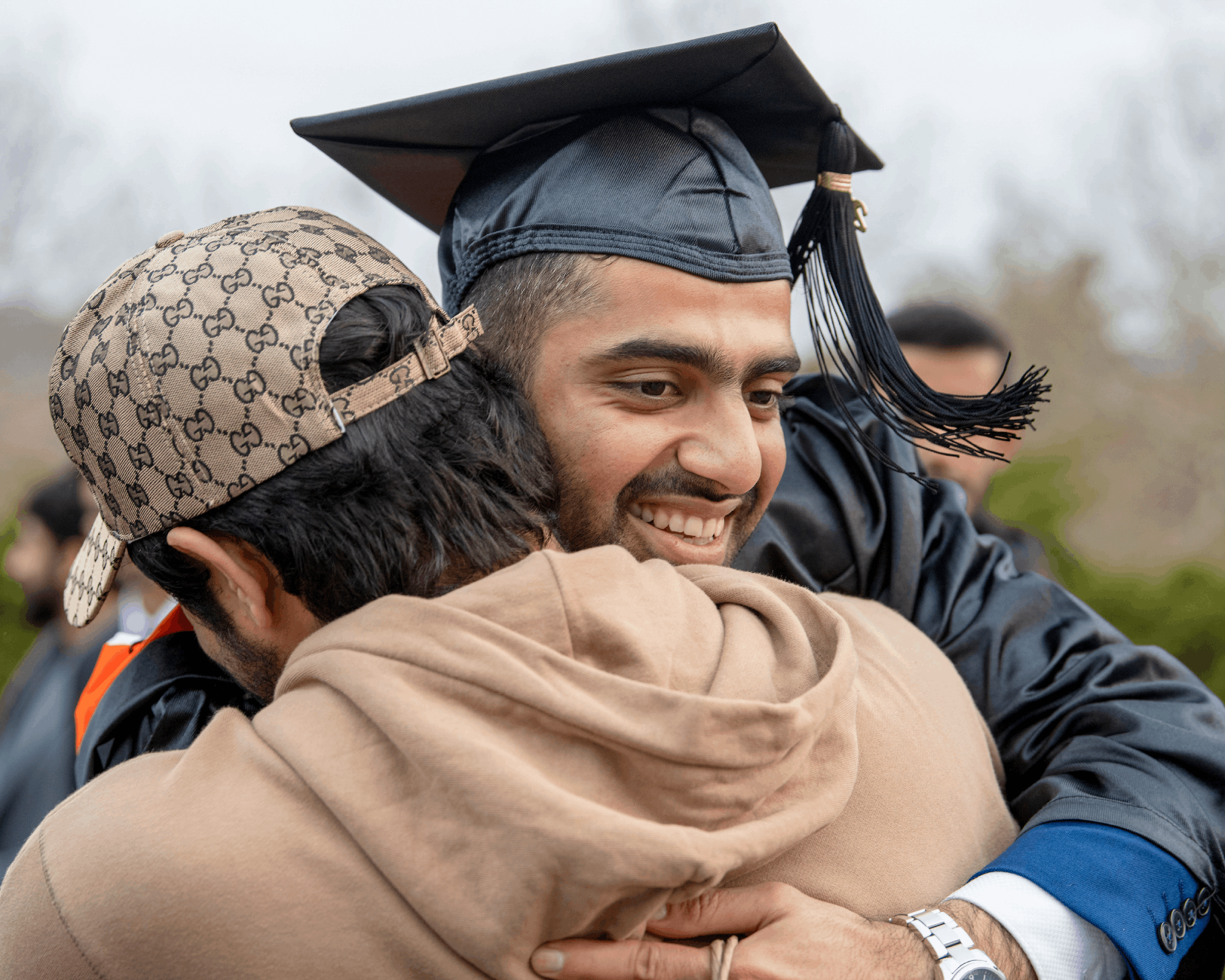 The graduates received a hug after the fall entrance ceremony.