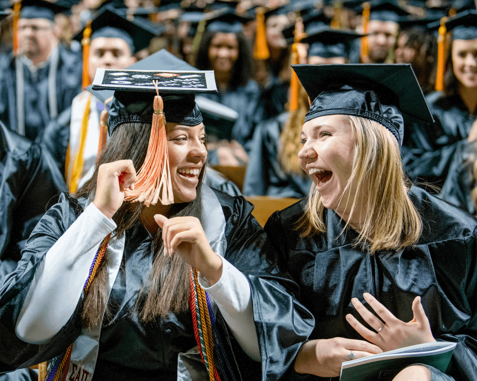 Graduates react at fall graduation.