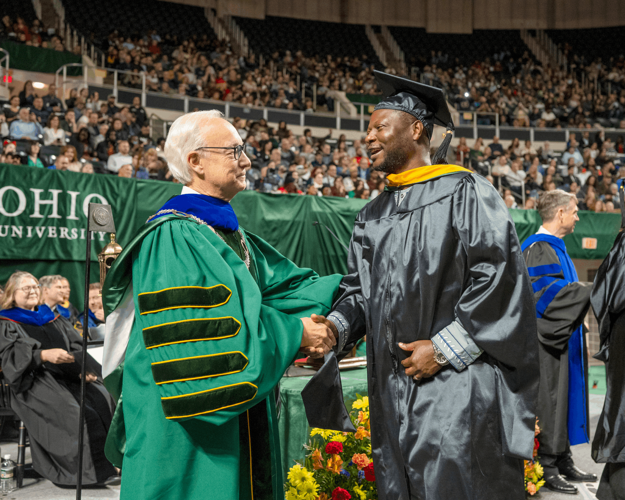 Ohio University President Hugh Sherman congratulates a graduate at Fall Commencement.