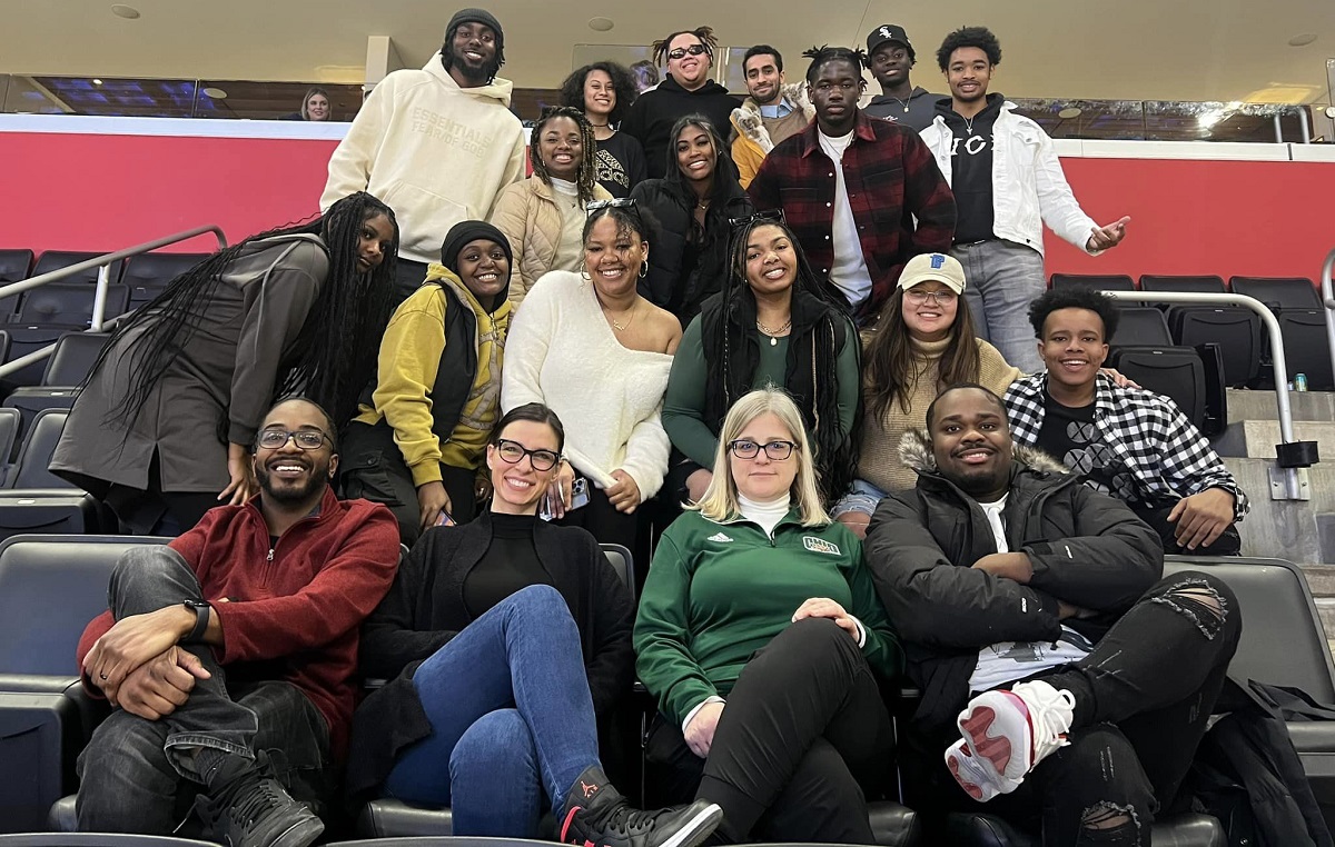 College of Business students are shown at a Detroit Pistons game