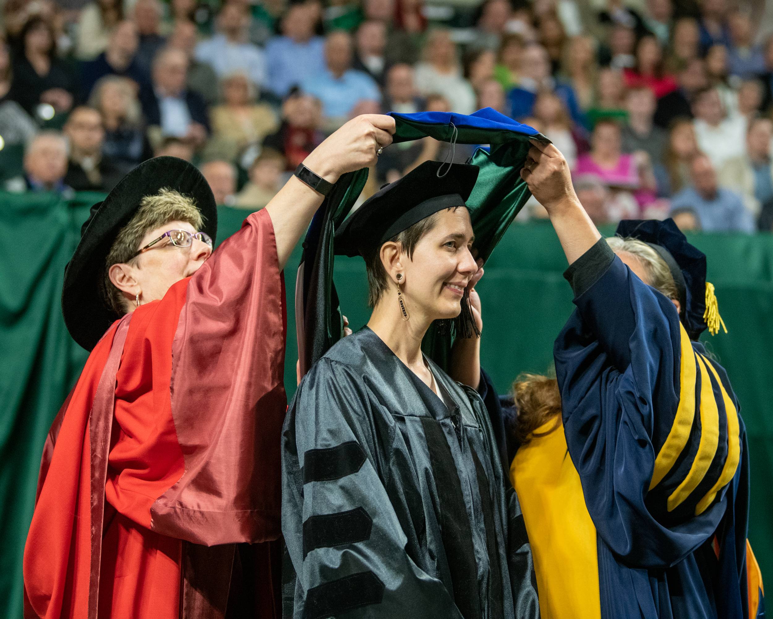 A Ph.D. student is hooded at the Friday, May 5, Commencement ceremony.