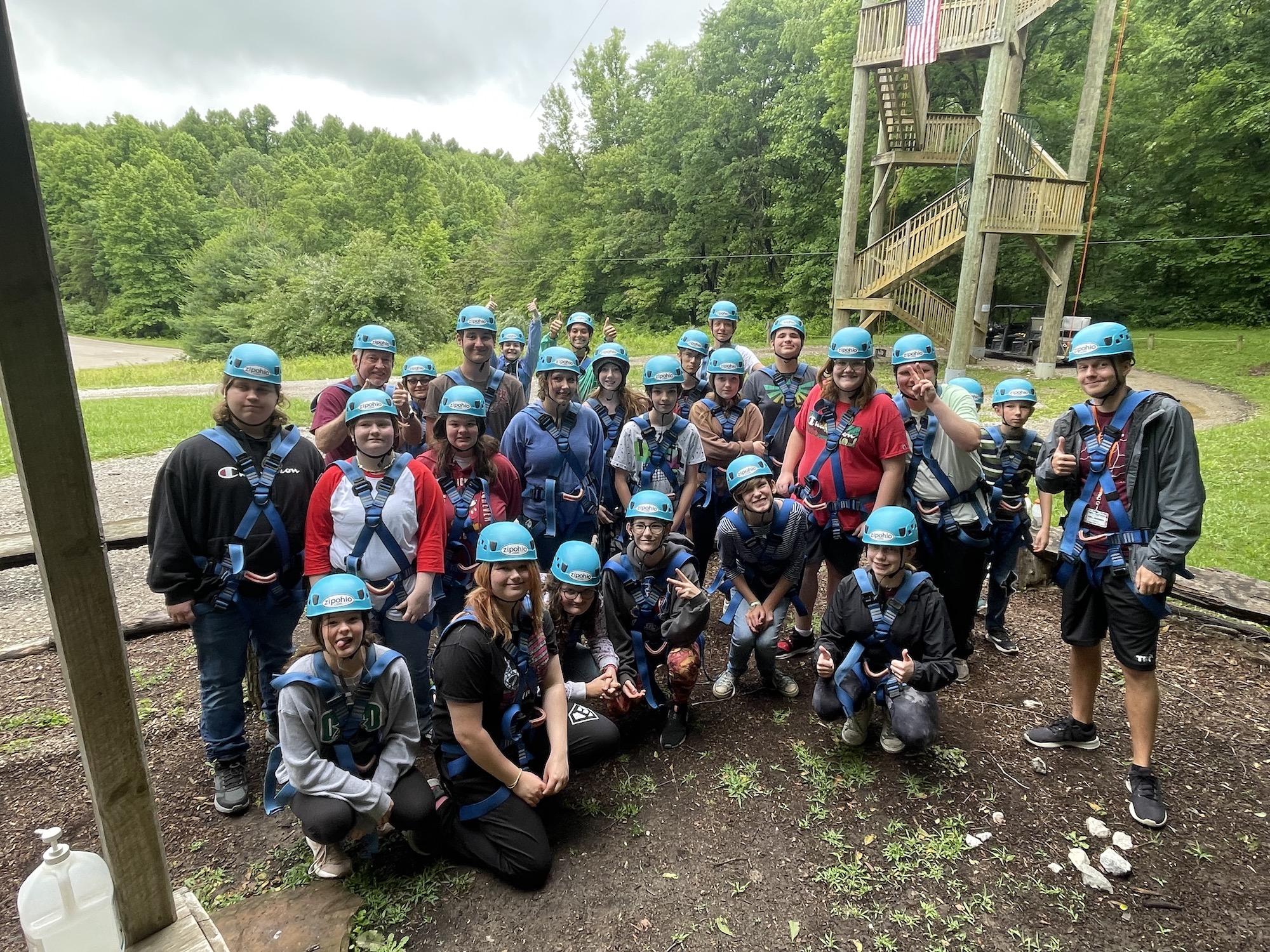 Campers pose together for a group picture in their zip-lining gear at Hocking Hills
