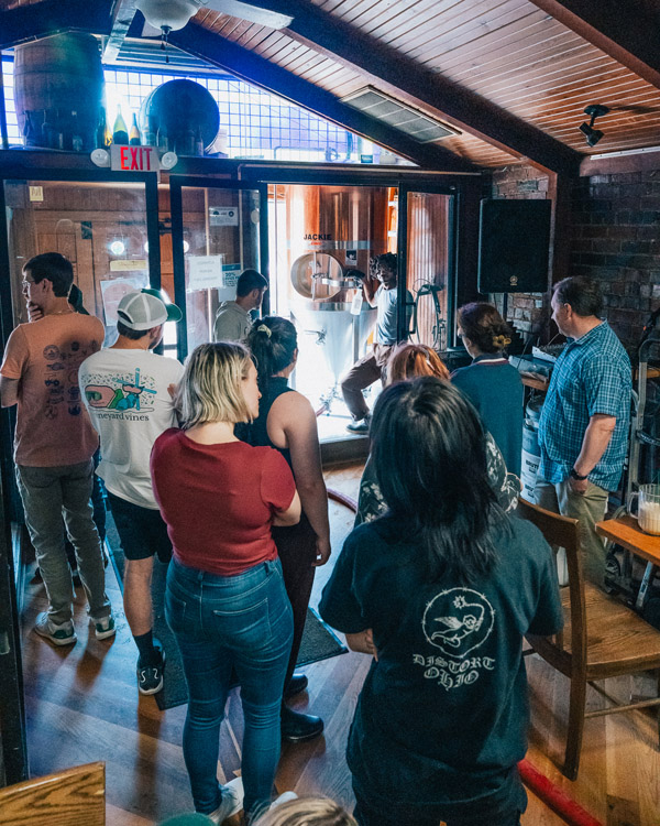 Michael Held, far right, and his students get a lesson in brewing at Jackie O's Brewery.