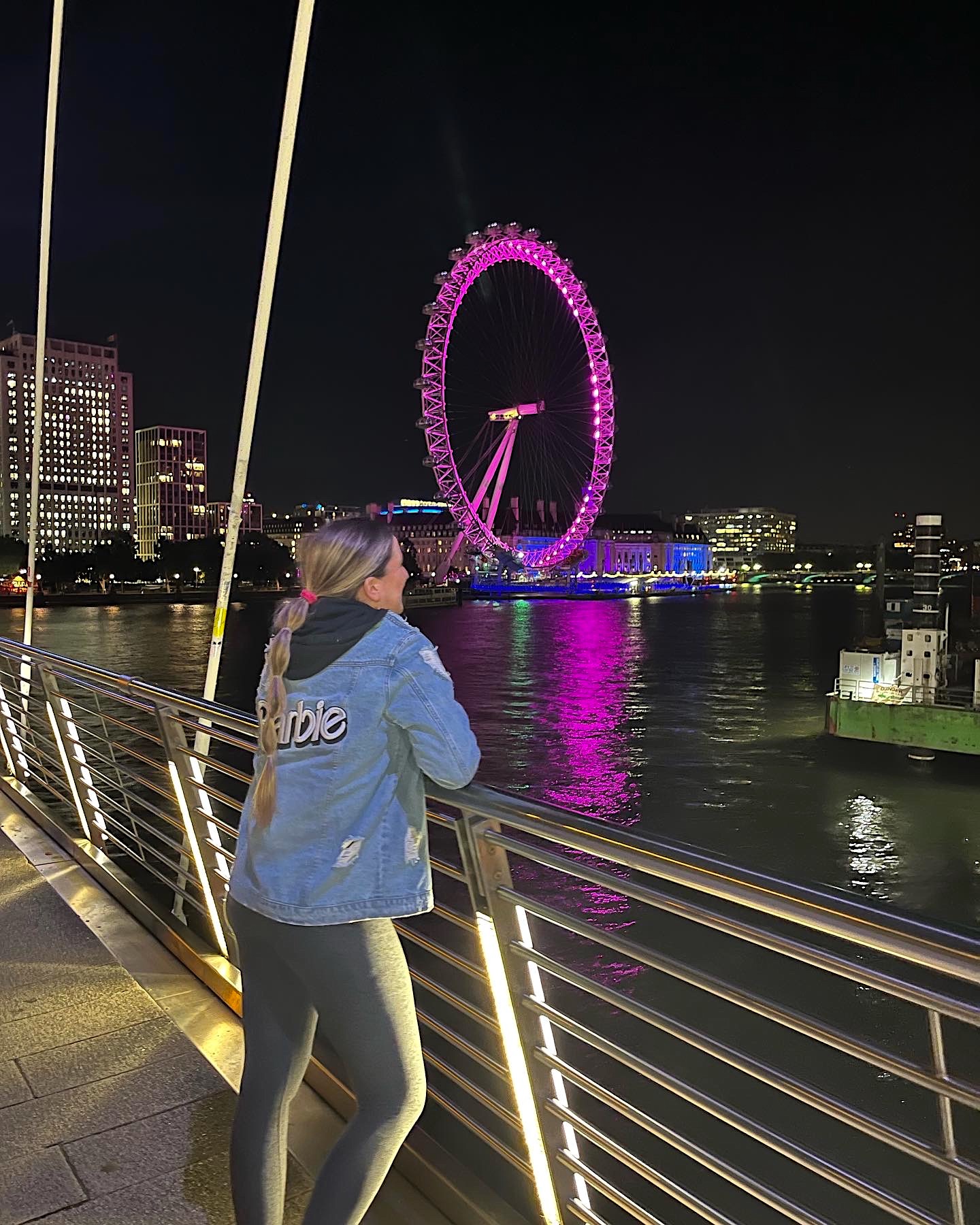 Carpenter watches as London's landmark buildings are lit up in signature Barbie pink in celebration of the premiere. 