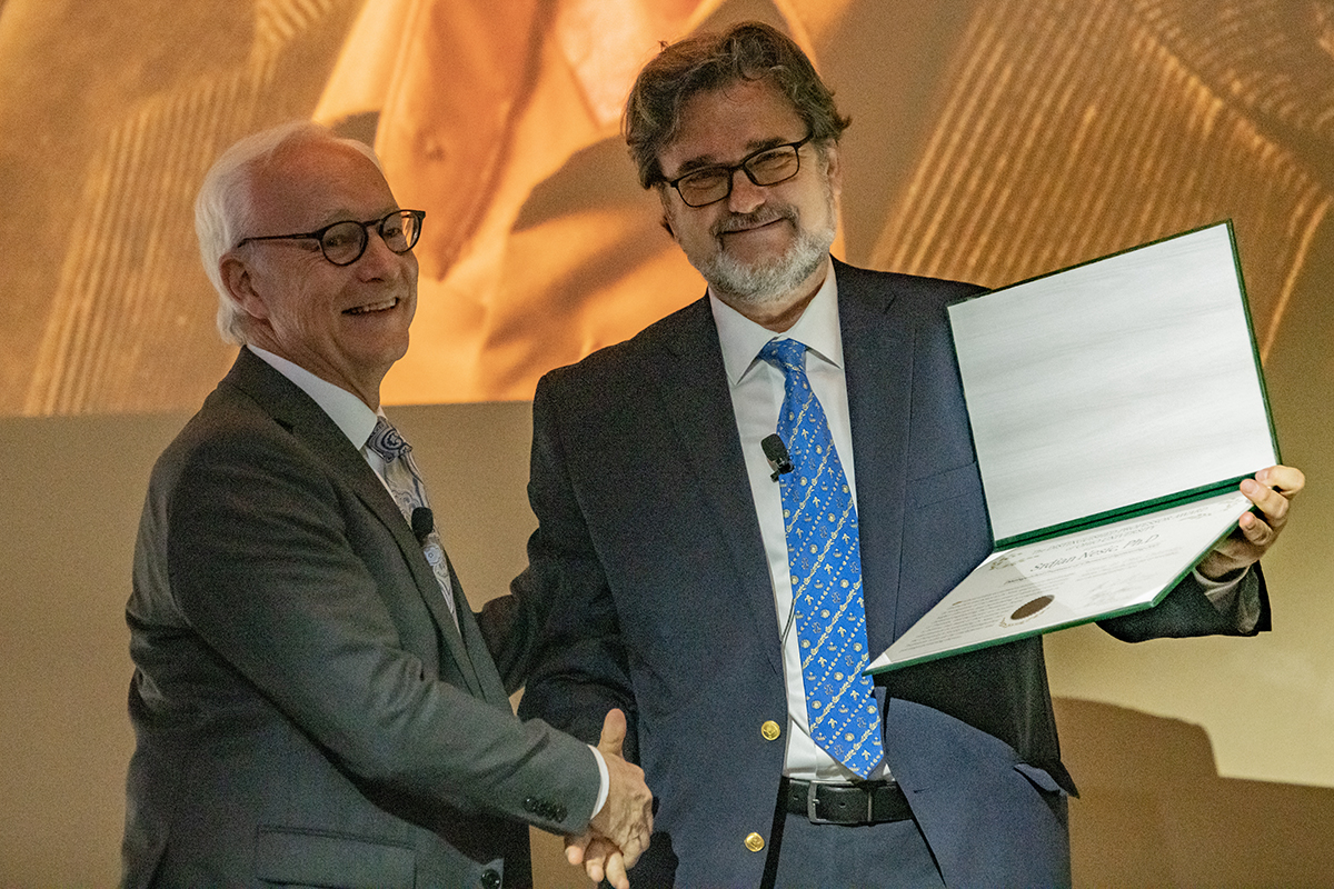 Dr. Dugh Sherman, former OHIO President, gives Srdjan Nesic his distinguished professor award