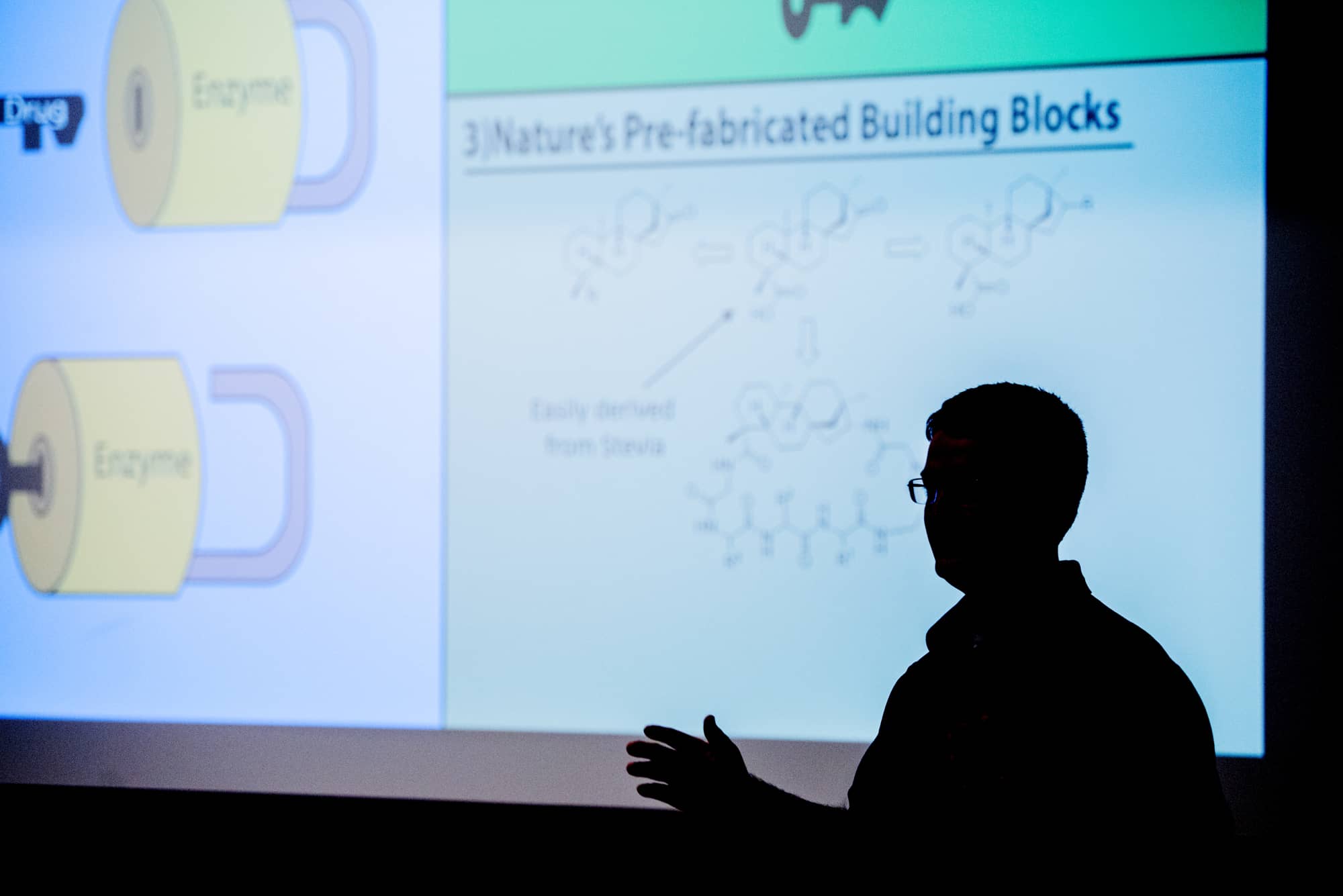 An OHIO graduate student presents research at a Three Minute Thesis competition at Stocker Center. Students have three minutes to present a compelling oration on their thesis and its significance. Five students won awards earlier this month.