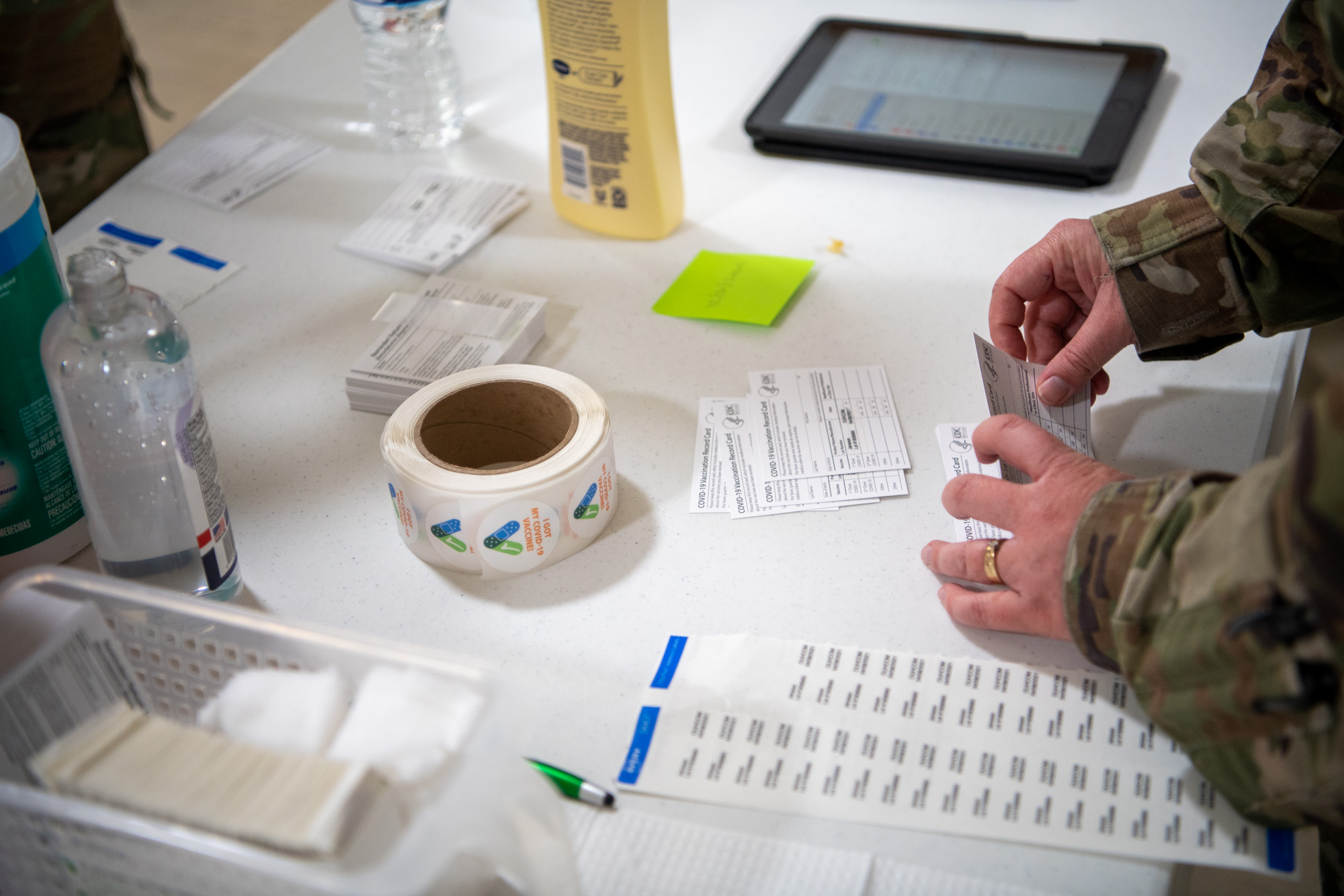 Vaccination materials being prepared by a National Guard medic